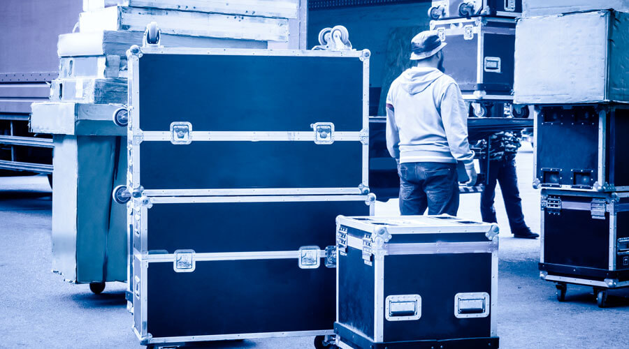 Cases unloaded from the truck by roadies